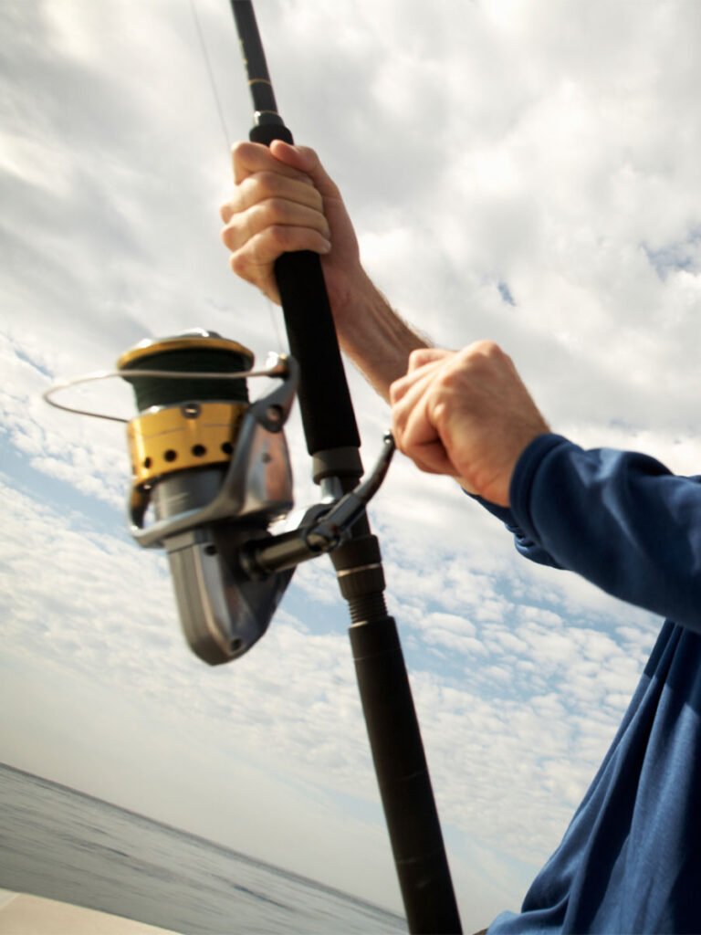 a man on a boat holding a fishing rod 2022 03 04 02 29 13 utc copyl