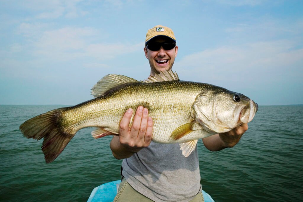 portrait of man holding fish 2022 05 26 01 54 51 utc copy